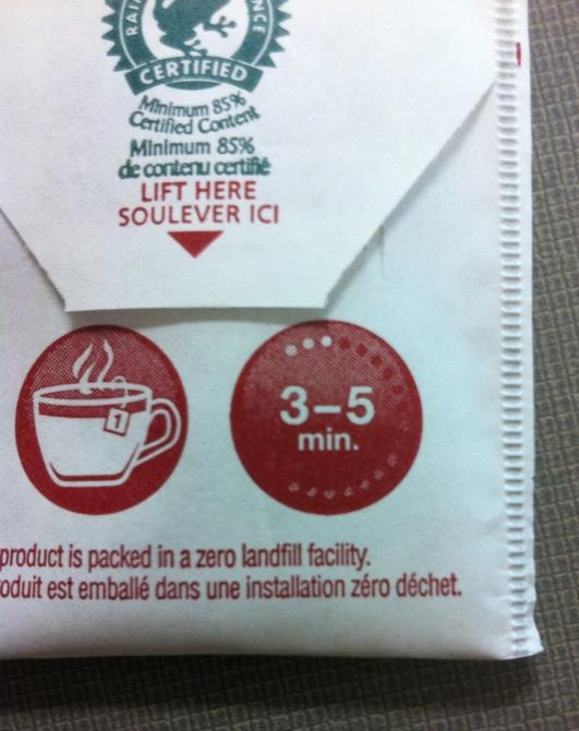 The image shows the back of a teabag with text “LIFT HERE” and a graphic showing the teabag in a cup with a numeral 1 and another graphic with the text “3-5 MIN.”